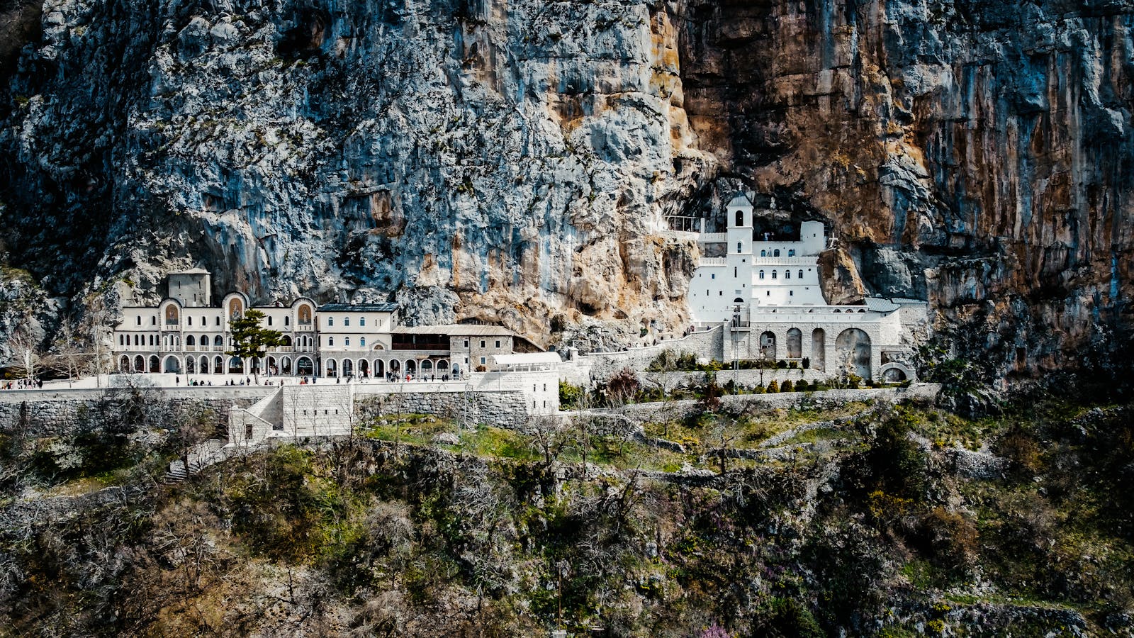 Ostrog Monastery built into the cliff face above the Zeta plain, Montenegro